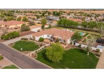Stunning aerial view of a single-Gathering home with lush landscaping, pool, and charming curb appeal in a desirable neighborhood at 21442 E Excelsior Ave, Queen Creek, AZ 85142