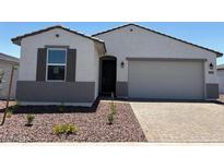 Charming single-story home featuring a well-maintained front yard and a two-car garage at 24369 W La Salle St, Buckeye, AZ 85326