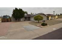 Charming single-story home featuring a well-manicured front yard and a circular driveway at 3708 W Redfield Rd, Phoenix, AZ 85053