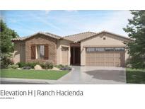 Charming single-story home with a stucco and brick exterior, a well-manicured lawn, and a spacious two-car garage at 3753 E Kenley Ln, San Tan Valley, AZ 85143