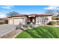 Charming single-story home featuring a terra cotta roof, well-manicured lawn, and a spacious three-car garage at 4823 S Oleander Dr, Chandler, AZ 85248