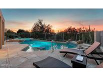 Enjoy a relaxing evening at the pool and hot tub in this backyard retreat at 6128 E Brilliant Sky Dr, Scottsdale, AZ 85266