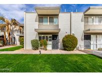Charming condo with a well-manicured lawn and cozy front entryway at 7720 E Heatherbrae Ave # 13, Scottsdale, AZ 85251