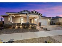 Charming home featuring a covered entrance, well-maintained landscaping, and a two-car garage at 10702 E Sheffield Dr, Mesa, AZ 85212