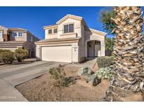 Charming two-story home with desert landscaping, attached two car garage, and neutral color palette at 13556 W Desert Flower Dr, Goodyear, AZ 85395