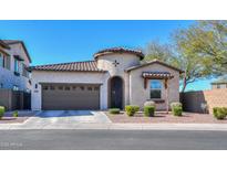 Charming single-story home with a well-manicured front yard and attached two-car garage and turret entry at 139 E Desert Broom Dr, Chandler, AZ 85286