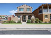 Charming two-story home with arched porch and well-maintained landscaping at 2260 S Deerfield Ln, Gilbert, AZ 85295