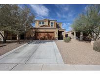 Charming two-story home with desert landscaping and a spacious two car garage at 3482 N 300Th Dr, Buckeye, AZ 85396