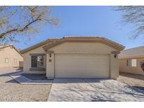 Charming single-story home featuring a two-car garage and a low-maintenance desert landscape at 4517 N 123Rd Dr, Avondale, AZ 85392