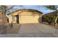 Charming single-story home with a well-maintained front yard and a two-car garage at 4517 N 123Rd Dr, Avondale, AZ 85392