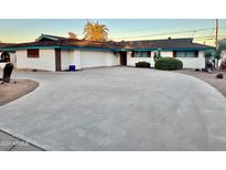 Charming single-story home featuring a large circular driveway and attached garage at 537 N Jay St, Chandler, AZ 85225