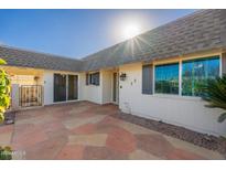 Exterior patio with tiled flooring and gated access at 10521 W Roundelay Cir, Sun City, AZ 85351