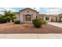 Charming home featuring decorative shutters, lovely landscaping, and a well maintained desert front yard at 1919 E Gary Way, Phoenix, AZ 85042