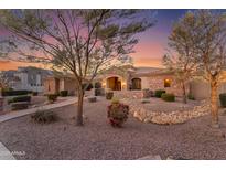 Charming single-story home with desert landscaping and a welcoming front entrance at sunset at 2998 E Waterman Way, Gilbert, AZ 85297