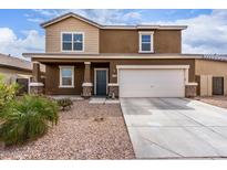 Two-story home featuring a two-car garage and a mix of stucco and siding exterior at 37295 W Cannataro Ln, Maricopa, AZ 85138