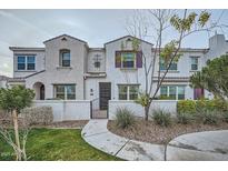Charming two-story townhome with landscaped yard, walkway, and gated front porch at 4077 S Sabrina Dr # 107, Chandler, AZ 85248