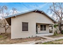Charming single-story home with a cozy front porch, quaint landscaping, and freshly painted in a neutral palette at 137 N Robson St # 2, Mesa, AZ 85201