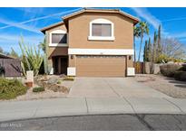 Charming two-story home with a well-manicured front yard, desert landscaping, and a convenient two-car garage at 23225 N 23Rd Pl, Phoenix, AZ 85024