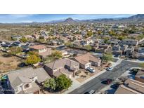 Scenic aerial view of a neighborhood with mountain backdrop, showcasing the home's desirable location at 4624 W Heyerdahl Ct, New River, AZ 85087