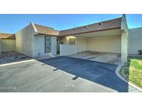 Beige single-story home featuring covered parking and low-maintenance landscaping at 5213 S Monaco Dr, Tempe, AZ 85283