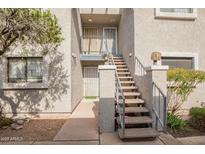 Building exterior with staircase leading to the upper level units at 15402 N 28Th St # 201, Phoenix, AZ 85032