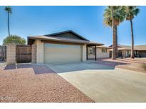 Charming single-story home featuring a two-car garage and desert landscaping at 5513 W Tierra Buena Ln, Glendale, AZ 85306