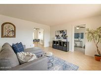 Inviting living room offering neutral colors, tile floors, and an open concept layout at 8038 S 25Th St, Phoenix, AZ 85042