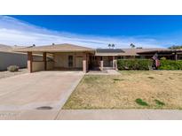 Charming single-story home with a covered carport and well-maintained front yard at 10816 W Venturi Dr, Sun City, AZ 85351