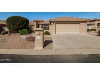 Inviting single-story home with a two-car garage and low maintenance desert landscaping at 23732 S Glenburn Dr, Sun Lakes, AZ 85248