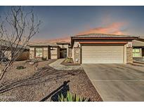 Charming single-story home with desert landscaping and neutral color palette at 3574 E County Down Dr, Chandler, AZ 85249