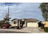 Charming single-story home featuring desert landscaping, a two-car garage, and a tile roof at 2010 E Indigo Dr, Chandler, AZ 85286