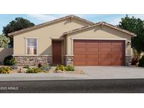 Charming single-story home featuring a two-car garage, stone accents, a covered entryway, and manicured landscaping at 3462 E Audrey Dr, San Tan Valley, AZ 85143