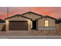 Beautiful single-story home featuring a two-car garage, neutral-toned stucco and a stone veneer accent at 4248 W Hannah St, San Tan Valley, AZ 85144