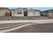 Charming single-story home featuring a two-car garage and low maintenance front yard at 44721 N 44Th Dr, Phoenix, AZ 85087