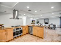 Bright kitchen featuring granite countertops, stainless steel appliances, and modern finishes in an open floor plan at 7121 E Rancho Vista Dr # 5011, Scottsdale, AZ 85251