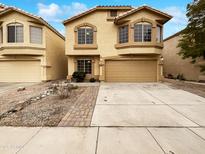 Inviting two-story home with a two-car garage and well-maintained landscaping at 1405 E Cathedral Rock Dr, Phoenix, AZ 85048