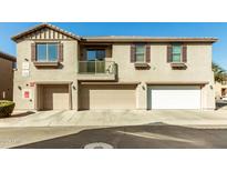 Inviting townhome with multiple garage spaces and balcony at 1458 N 80Th Ln, Phoenix, AZ 85043