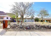 Charming single-story home featuring desert landscaping with cactus and rock features in a desirable neighborhood at 1515 E Sunnyslope Ln, Phoenix, AZ 85020