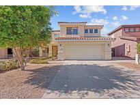 Charming two-story home with a well-maintained front yard and a two-car garage at 16618 S 28Th Pl, Phoenix, AZ 85048