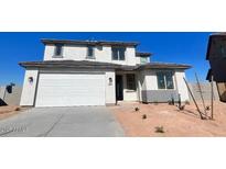 Charming two-story home featuring a spacious two car garage and desert landscaping at 18433 W Monte Lindo Ln, Surprise, AZ 85387