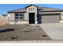 Charming single-Gathering home with a low maintenance front yard, two-car garage, and stylish gray exterior at 18848 E Bruno Dr, Gold Canyon, AZ 85118