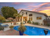 Inviting backyard pool, lush landscaping, and a tranquil patio create a perfect outdoor oasis at 3482 W Shannon St, Chandler, AZ 85226