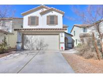 Charming two-story home with a spacious two-car garage and beautiful desert landscaping at 40564 W Nicole Ct, Maricopa, AZ 85138