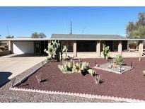 Charming home featuring desert landscaping with cacti and gravel accents in the front yard at 422 S 76Th Way, Mesa, AZ 85208