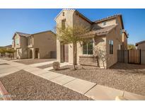 Charming two-story home with stone accents and a well-manicured desert landscape at 5430 W Odeum Ln, Phoenix, AZ 85043