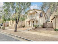 Inviting two-story home with front porch, landscaped yard and well-maintained facade at 110 N 66Th Ave, Phoenix, AZ 85043