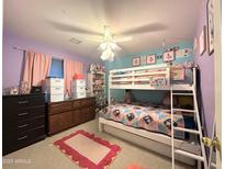 Cozy bedroom featuring a bunk bed, soft rug, and colorful decorations, creating a playful space at 1636 E Marigold St, Casa Grande, AZ 85122