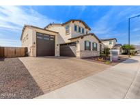 Stunning two-story home features a spacious driveway leading to a two-car garage and neutral color palette at 18609 W Diana Ave, Waddell, AZ 85355