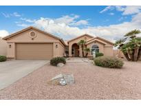 Single-story home featuring a two car garage and a desert landscaped front yard at 26681 S Howard Dr, Sun Lakes, AZ 85248