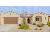 Charming home featuring a well-manicured front yard with desert landscaping and a two-car garage at 3932 E Torrey Pines Ln, Chandler, AZ 85249